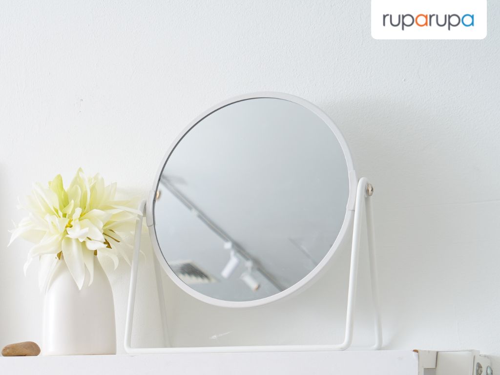 Cermin kamar mandi bulat berwarna putih dengan desain minimalis